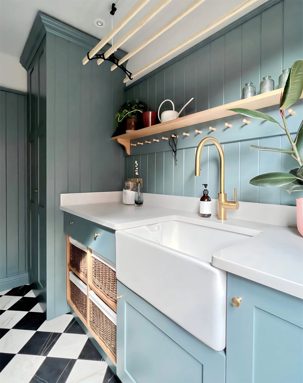 Blue classic utility room with peg rail oak shelf and pulley clothes airer