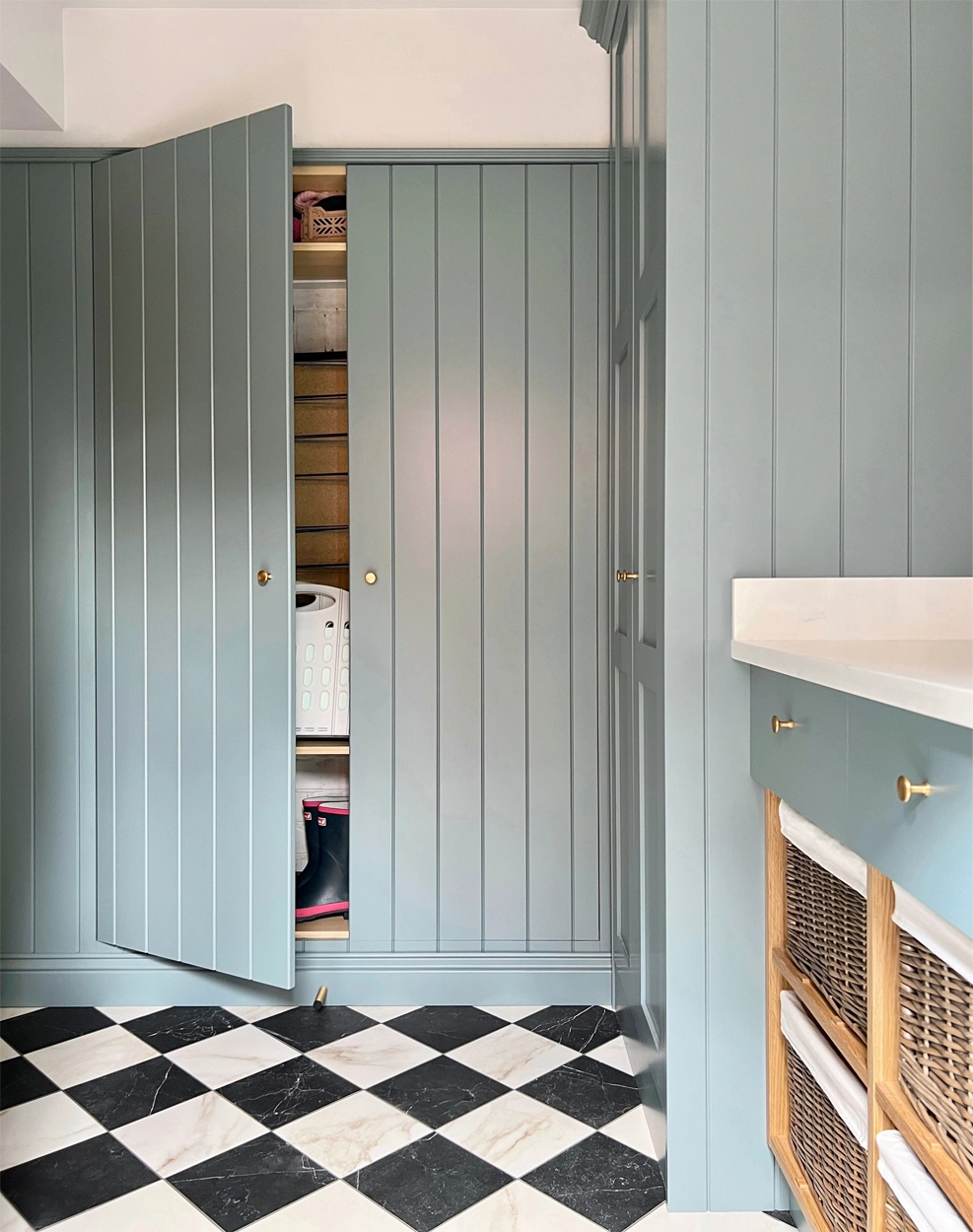 Blue classic utility room with secret storage hidden doors