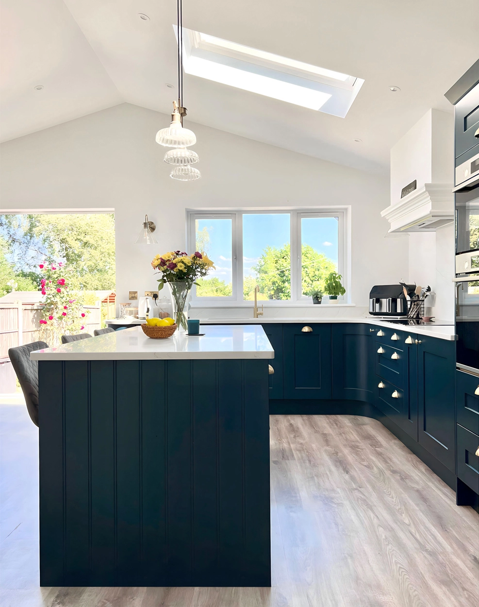 Open plan kitchen diner with vaulted roof - design by First Sense Interiors