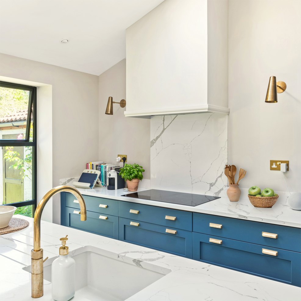 Blue modern shaker kitchen with sink in island - design by First Sense Interiors