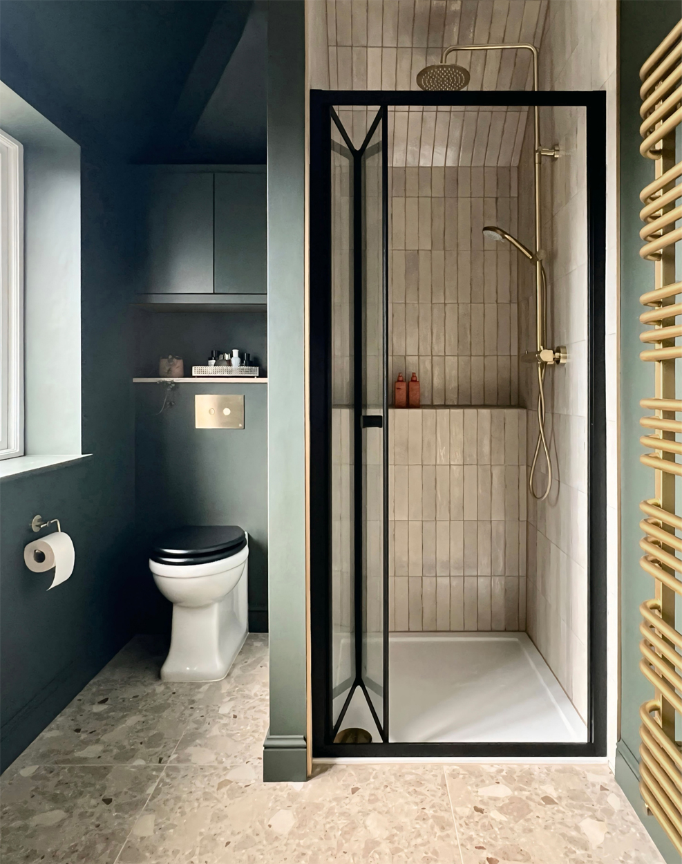 Dark green ensuite shower room bathroom with terrazzo floor - design by First Sense Interiors